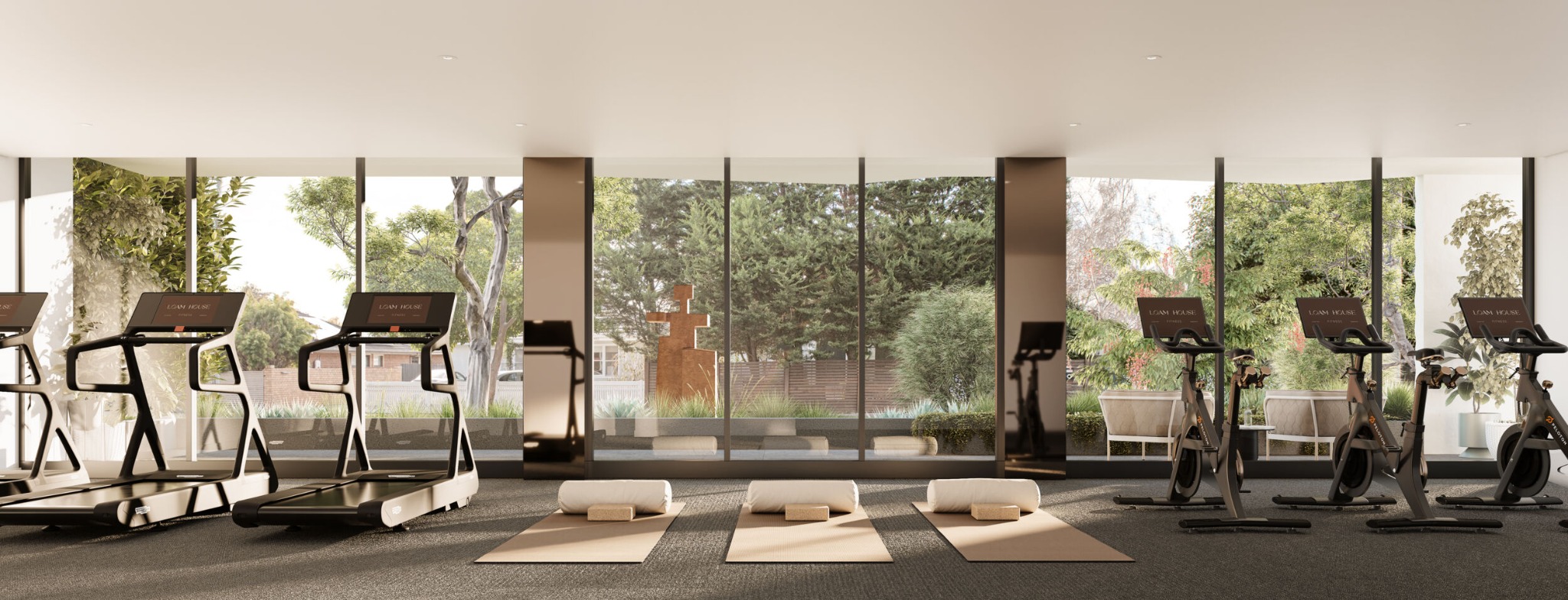 Loam House residents gym overlooking landscaped gardens